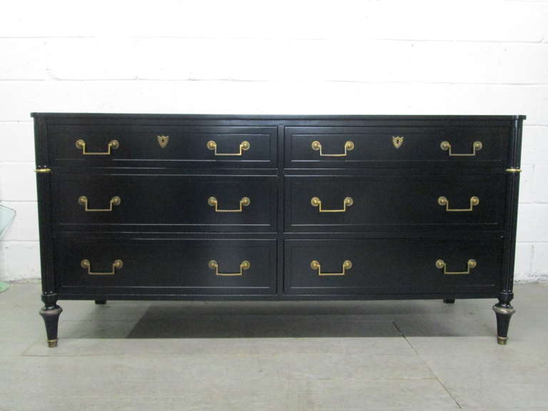 Baker Six Drawer Dresser.  Black lacquered dresser with gold handles.  Has a French style.