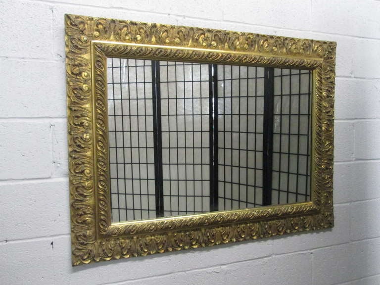 Stunning and well made gold gilt mirror. The mirror has a rectangular shape.