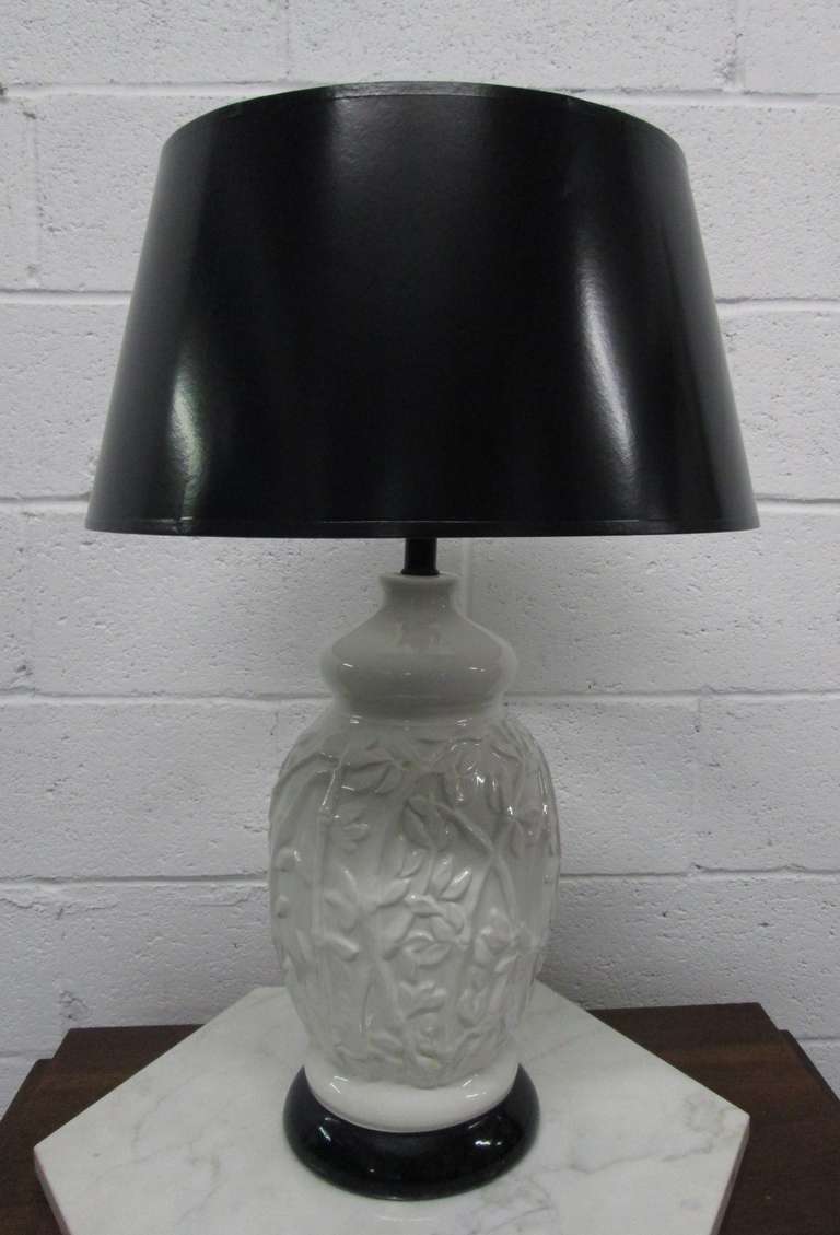 Pair of white ceramic lamps with floral pattern.
Shades not included.
 