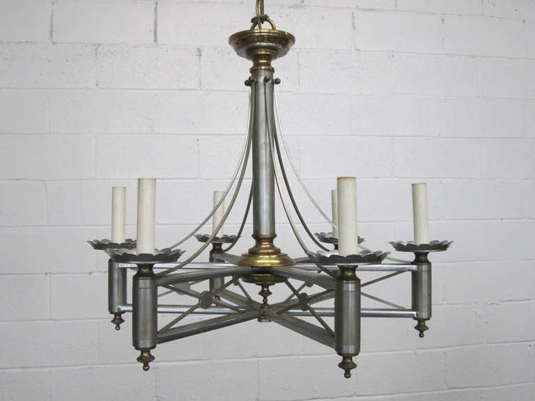 Six-candle chandelier that is well designed by Maison Jansen.