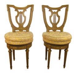 Pair of Carved Antique Swivel Chairs