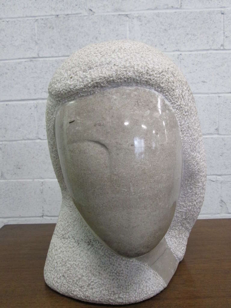 Modern marble bust sculpture that is well designed. Would make a great addition to a modern interior.