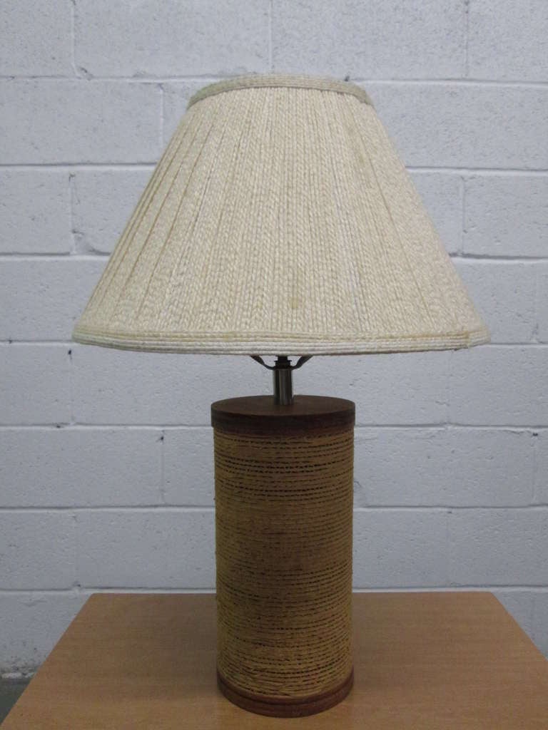 Cylindrical form cardboard lamps with wood trim. One has green felt bottom. Measures: 22.5