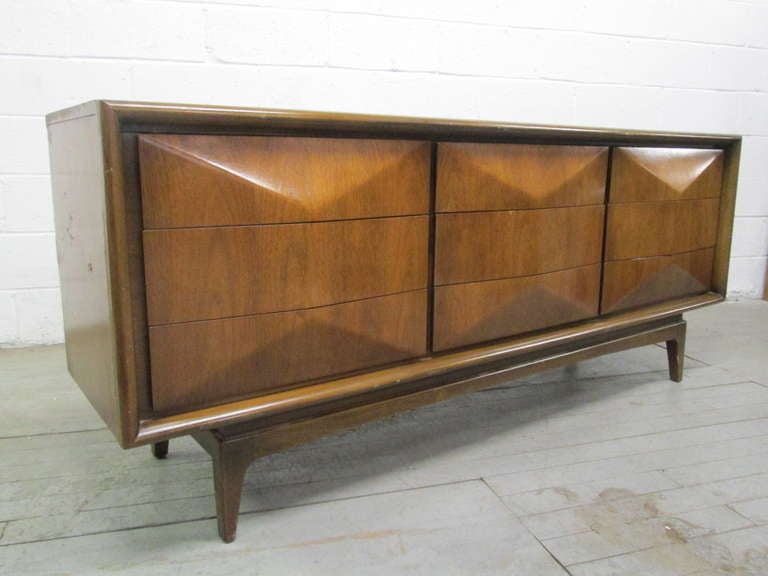 Remarkable diamond front dresser.  Can also be used as a credenza.  Has a total of 9 drawers with a 3 dimensional diamond front pattern to the front of drawers.