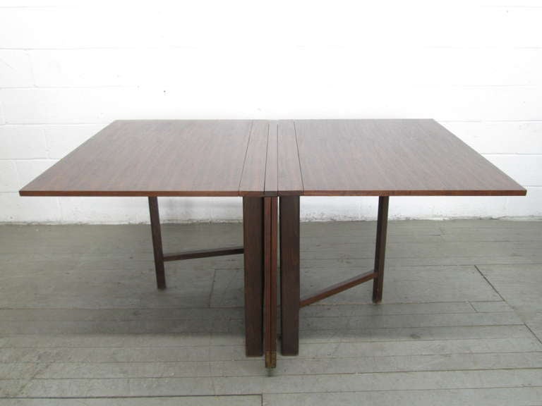 Expandable gate leg dining table designed by Bruno Mathsson. Manufactured in Sweden, Danish modern style. Brass piano hinges. Can be used in various positions.

Fully open measures 110