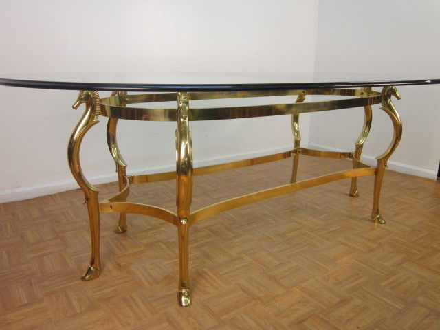 Excellent vintage brass table with seahorses. Nice beveled glass top. Nice center or dining table.