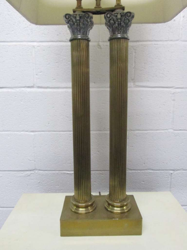 Pair of brass Corinthian double column lamps. Corinthian capital is metal. 

Measures: 38