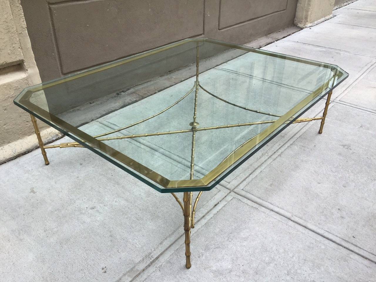 Large bronze faux bamboo coffee table. Table has an octagonal shape.