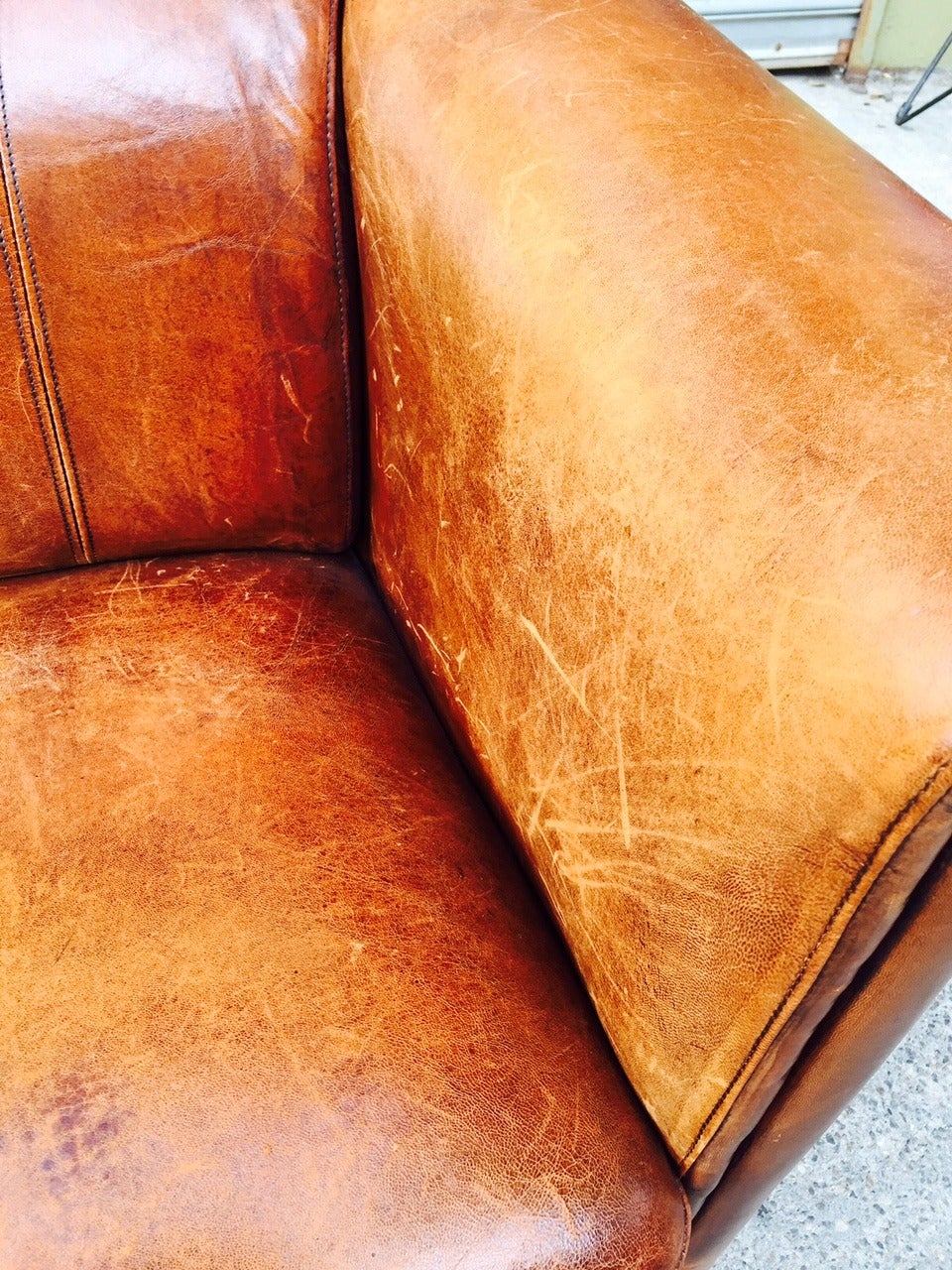 distressed leather loveseat