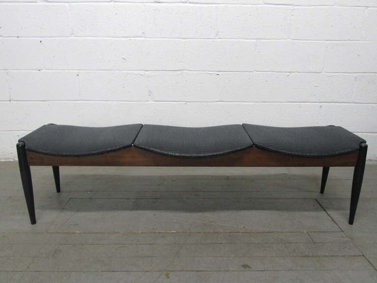 Seats have black vinyl reptile pattern and a walnut frame.  Great looking bench for a mid century modern interior.