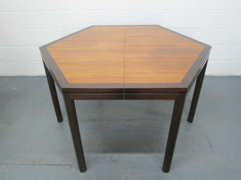 Edward Wormley for Dunbar Dining Table with  Two Extension Boards.
Table has a hexagonal shape and is mahogany with an ebonized mahogany trim and legs.
Measures (without extension leaves) 52