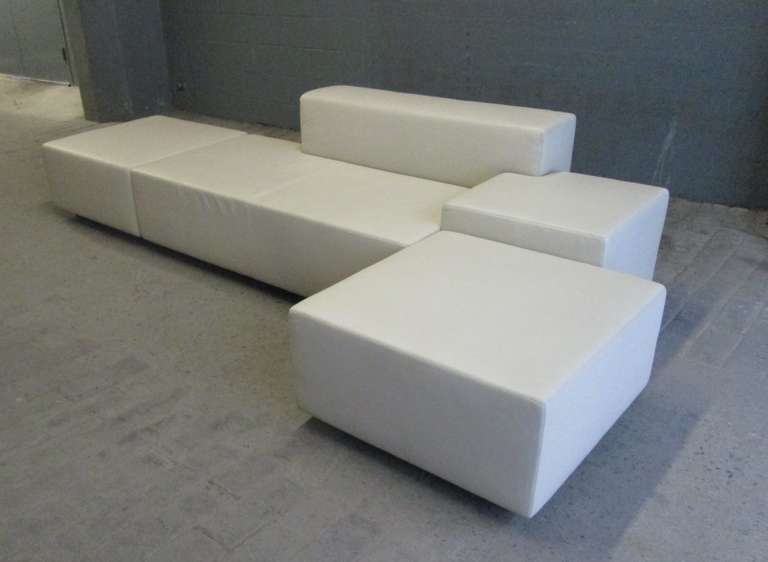 Poltrona Frau leather sofa sectional. Sofa consists of three pieces: Two ottomans and a sofa. 
Both ottomans measures: 32
