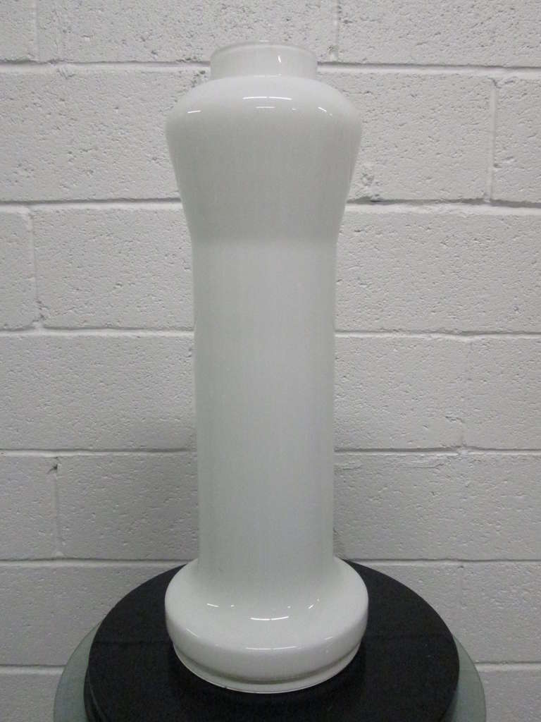 Italian Artemide Murano Glass Lamp has a white metal base.