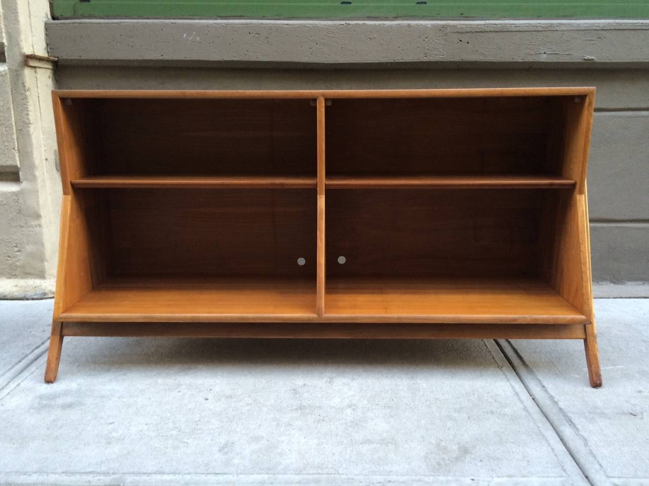 Open bookcase for Drexel by Stewart McDougall and Kipp Stewart. Item is walnut with sculptural sides.
The depth of the bottom is 16.5