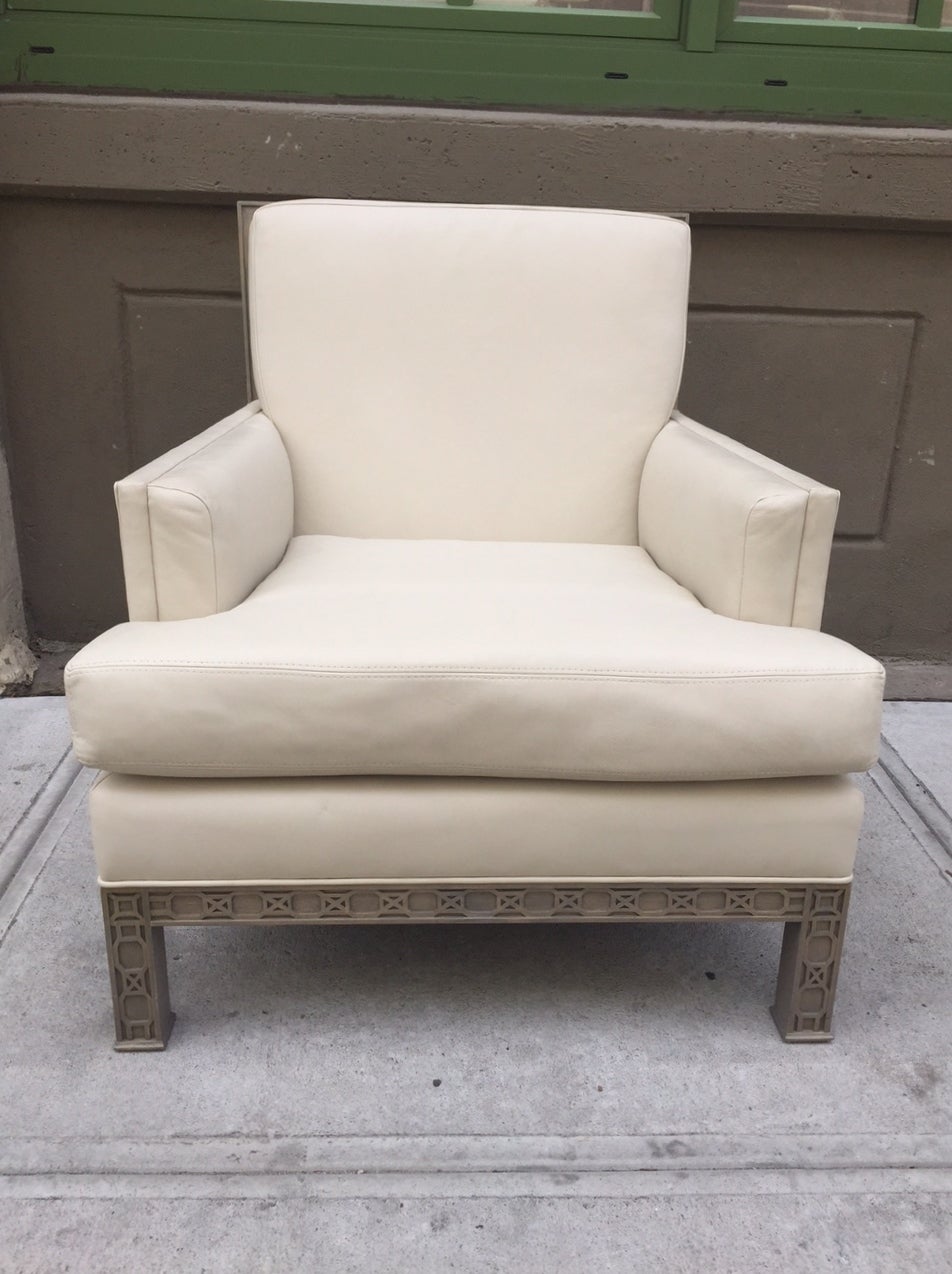 Pair Leather Chinese Chippendale Lounge Chairs.  Chairs are ivory leather with fret work to the base and legs.  Has a Chippendale carved back and a cerused like finish.