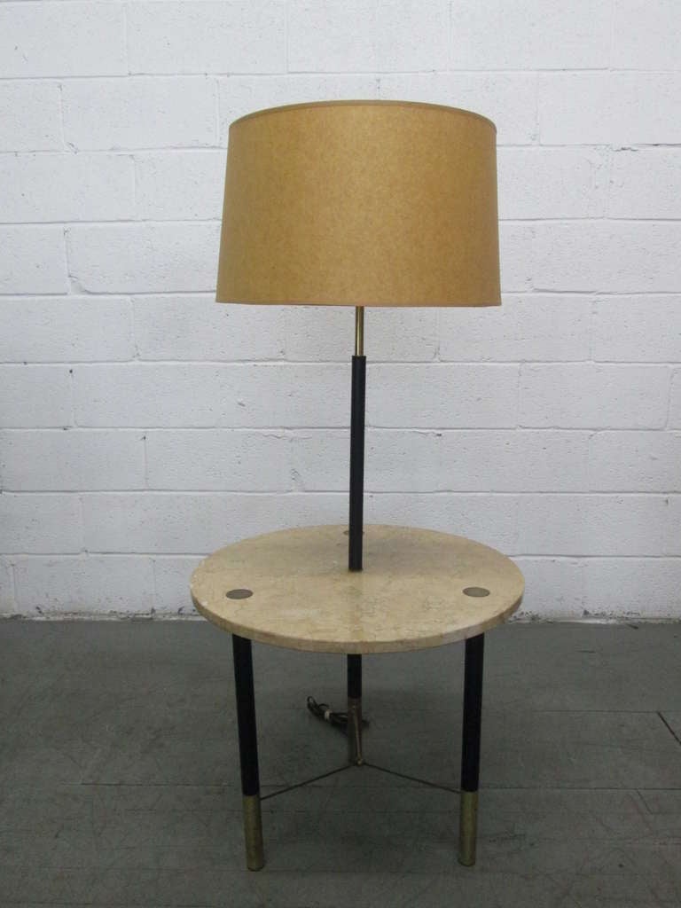 Classic Harvey Probber floor lamp with a brass frame and black lacquered legs which supports a marble top.  Measures:  50