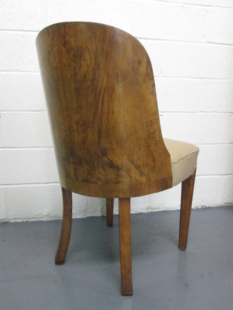 Set of four Art Deco burl and upholstered dining chairs.