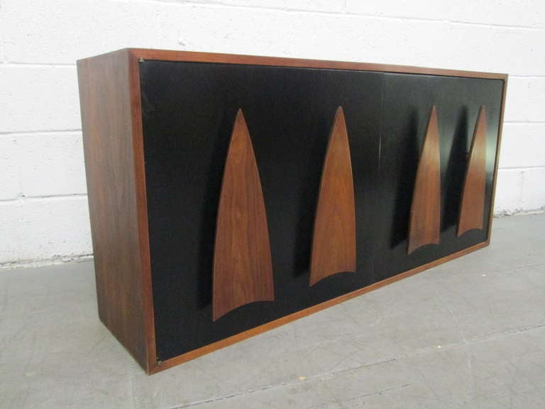 Lovely walnut sculpted handles, doors are black lacquered, has adjustable shelves with two pull out drawers inside.