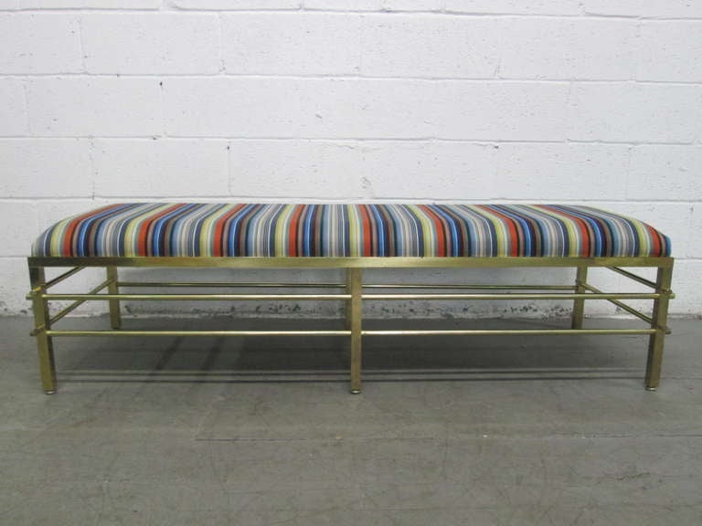 Solid brass bench upholstered in Maharam fabric