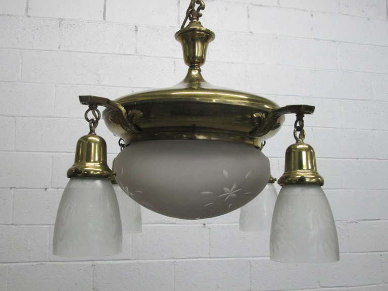 Brass French Art Deco hanging light fixture. Globes have etched floral pattern.