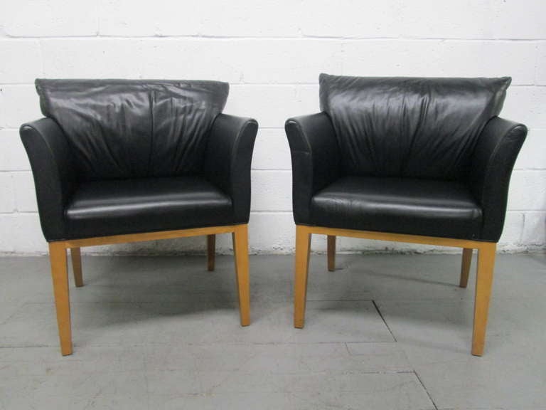 Pair Black Leather Arm Chairs.  Has wood legs.  Leather is very soft. 
The height of the chairs is 34
