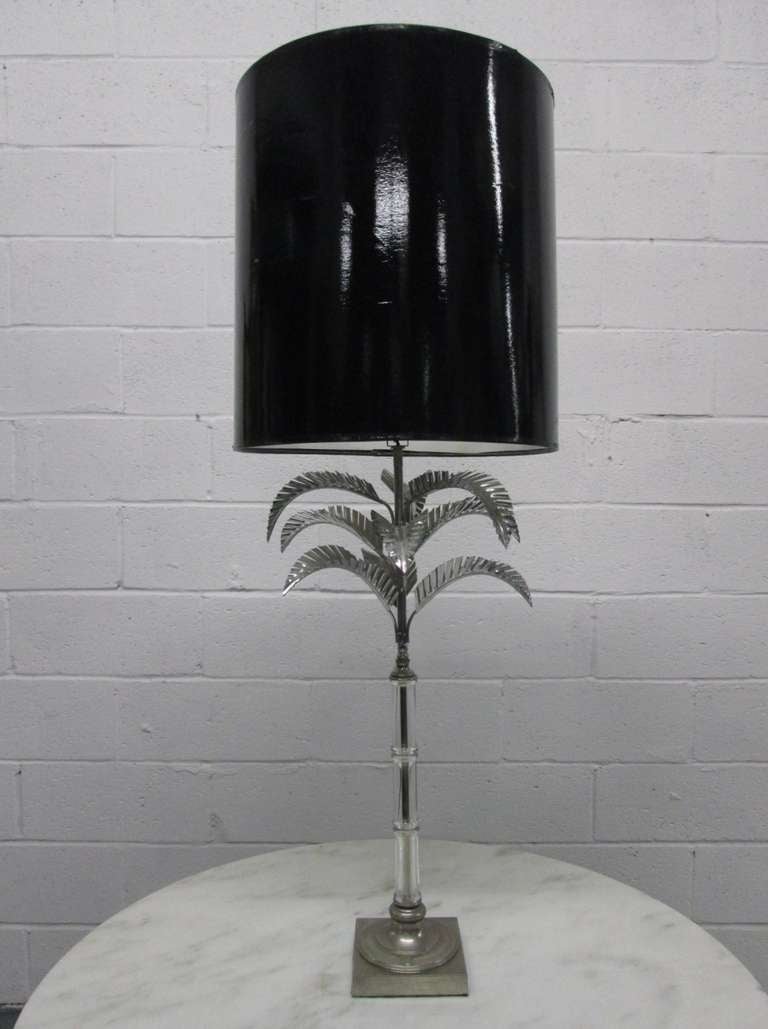 Stylish palm tree table lamp. Has a glass stem and the leaves and base are chrome-plated. Shade not included.
Measures: 37