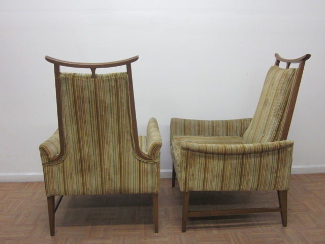 Pair of Asian inspired upholstered chairs attributed to James Mont.  Chairs have stripped fabric pattern and a wood frame.