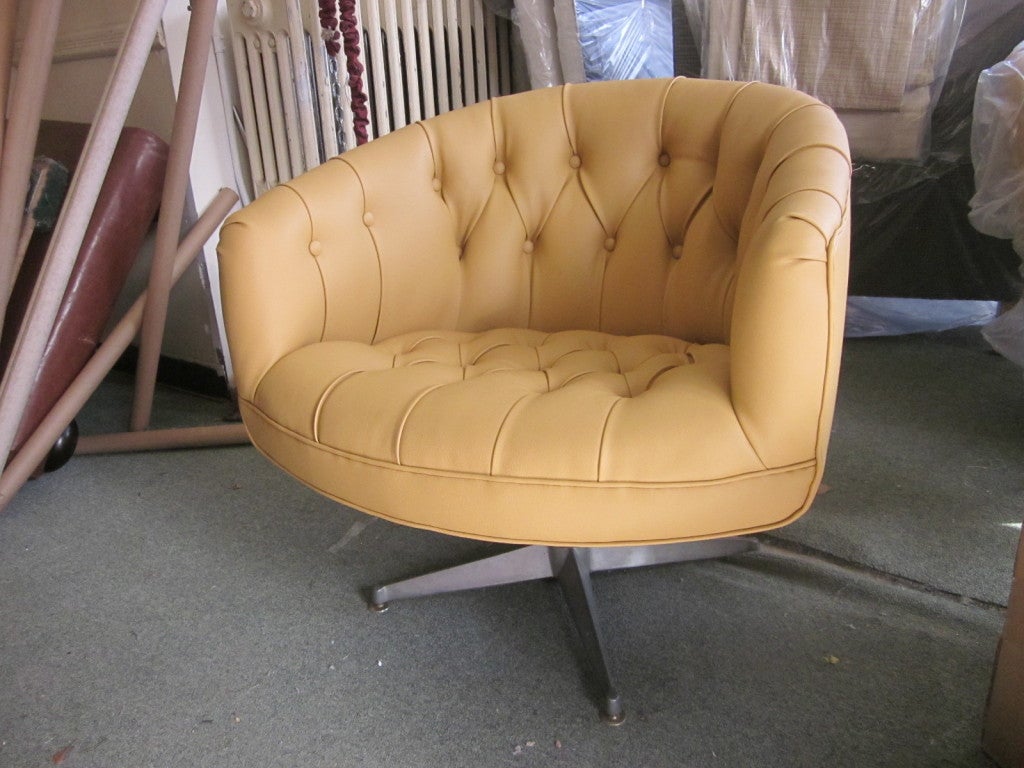 Gorgeous pair of newly upholstered Ward Bennett tufted, swivel chairs.