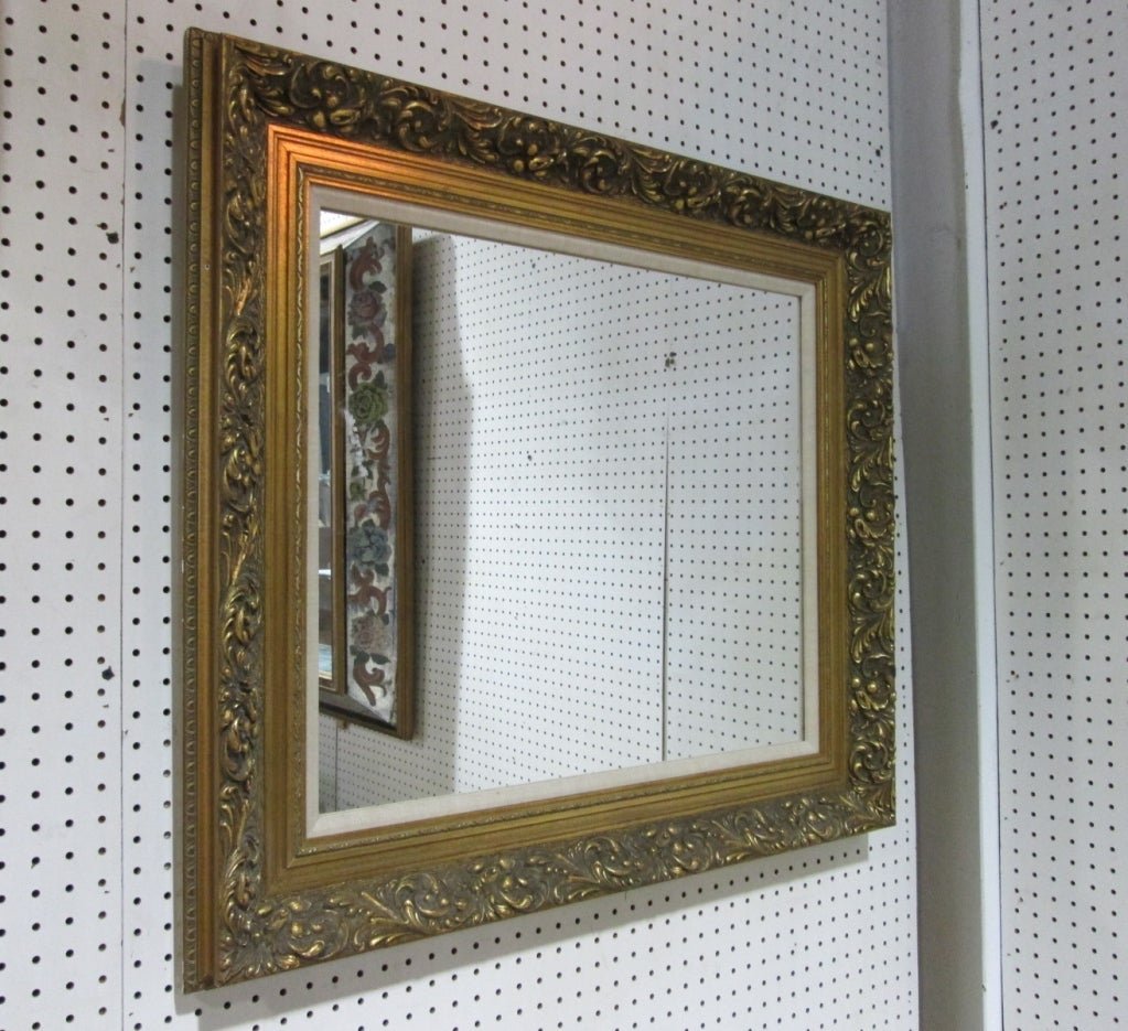 Has a lovely decorative gold frame.