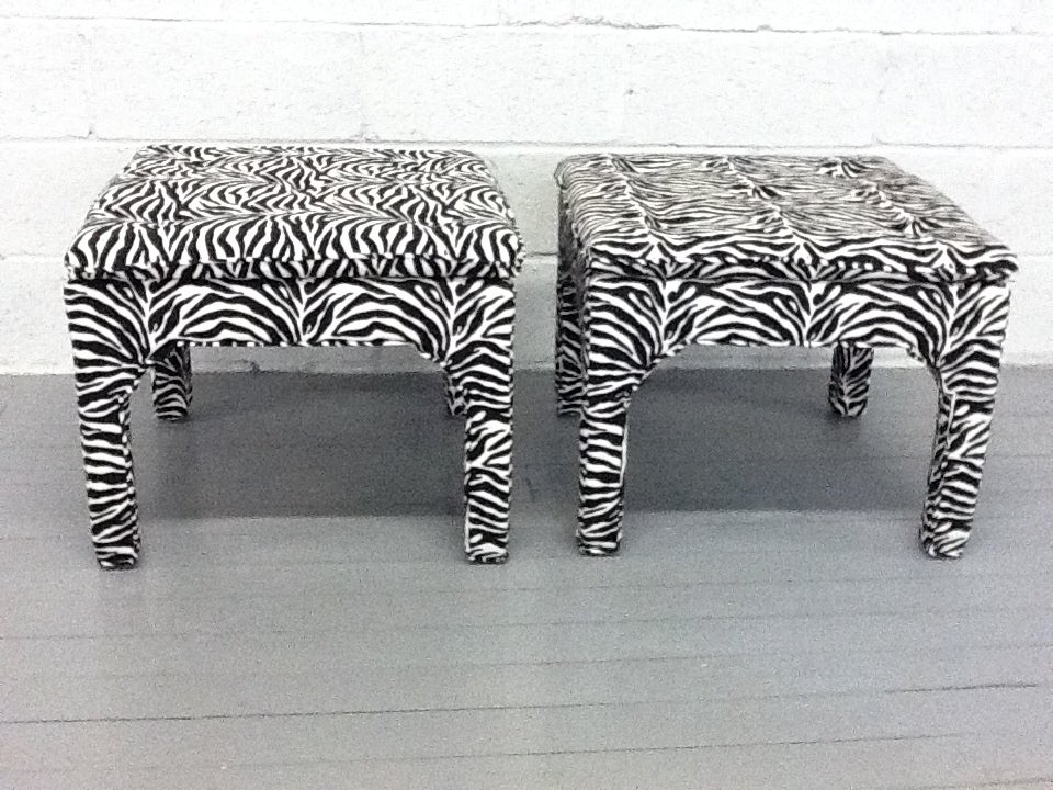 Awesome pair of benches with zebra print upholstery. Top is tufted.