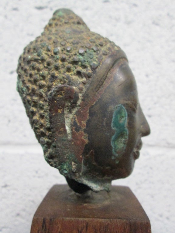 Asian Bronze Buddha Head on Stand For Sale