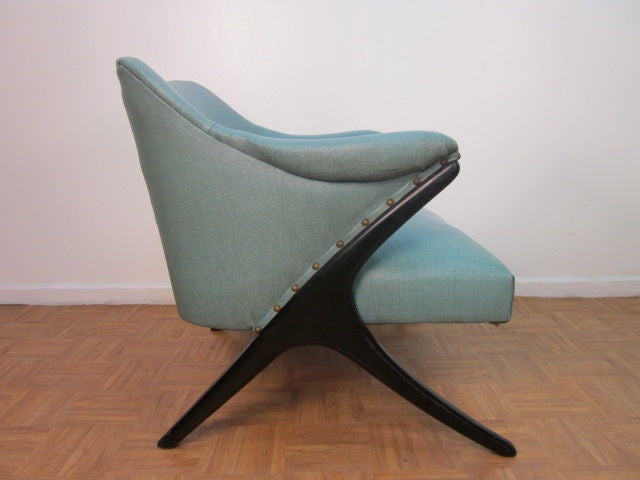 Wonderful pair of Italian upholstered chairs, black lacquered sculpted wood legs with turquoise naugahyde upholstery.
