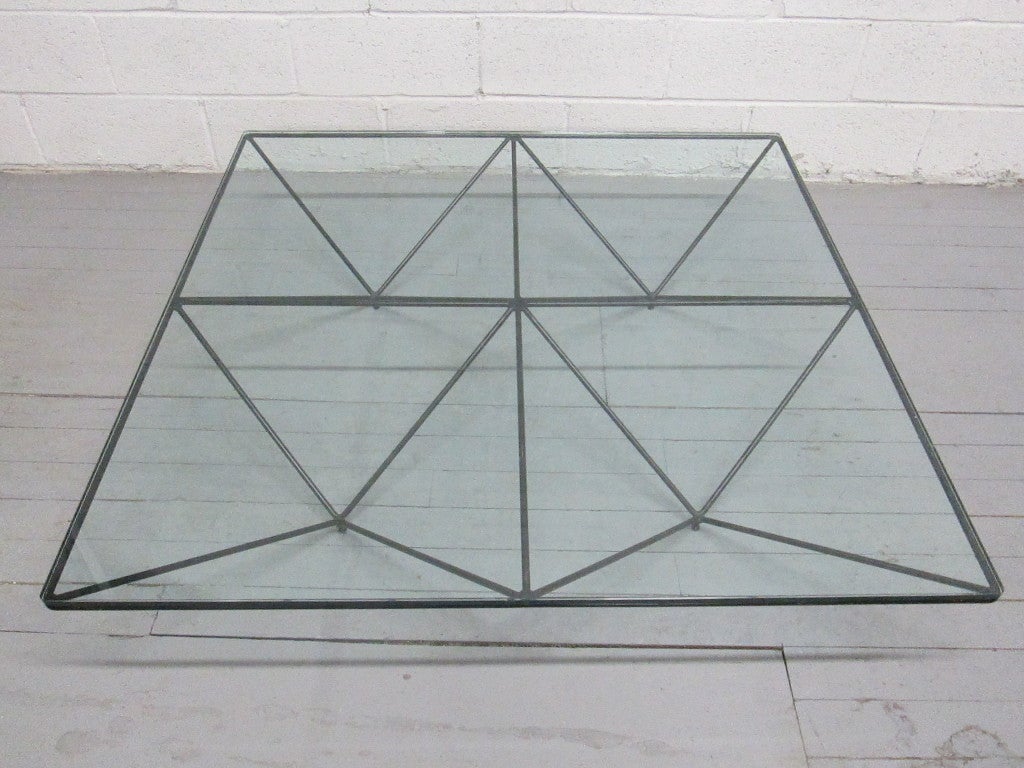 Paolo Piva coffee table with an enameled metal base and glass top.