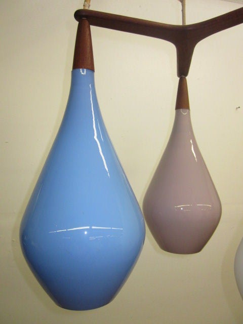 Beautiful, three-pendant light fixture with walnut trim.
Measurements of a single pendant 17