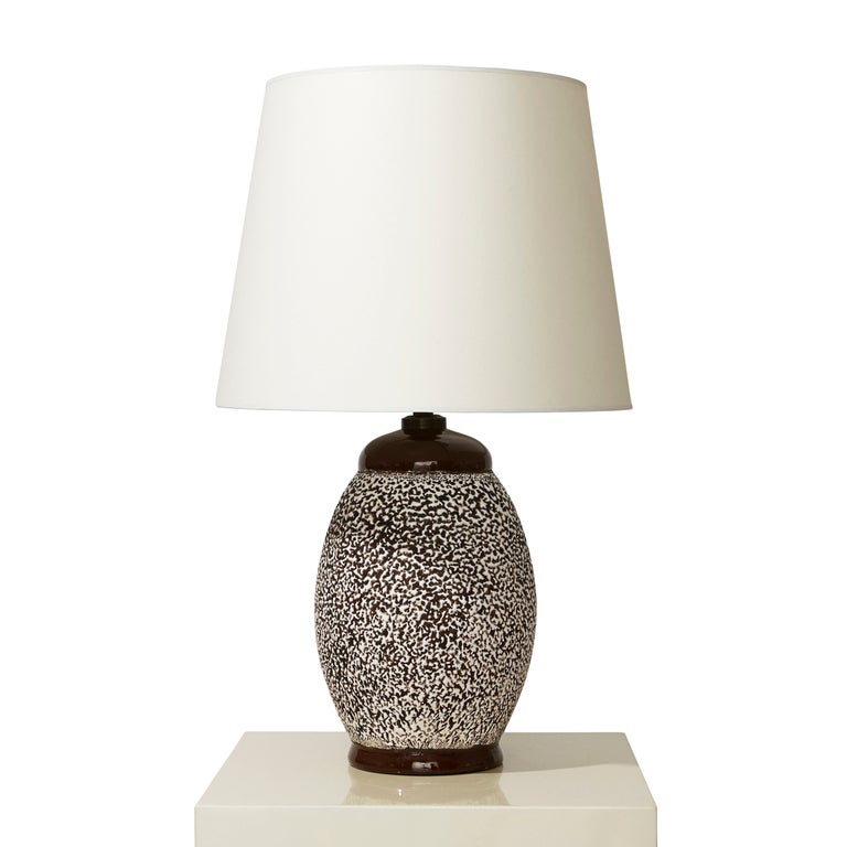 Elegant table lamp with ovoid form and rich textural glazing by Jean Besnard (1889-1958). The 