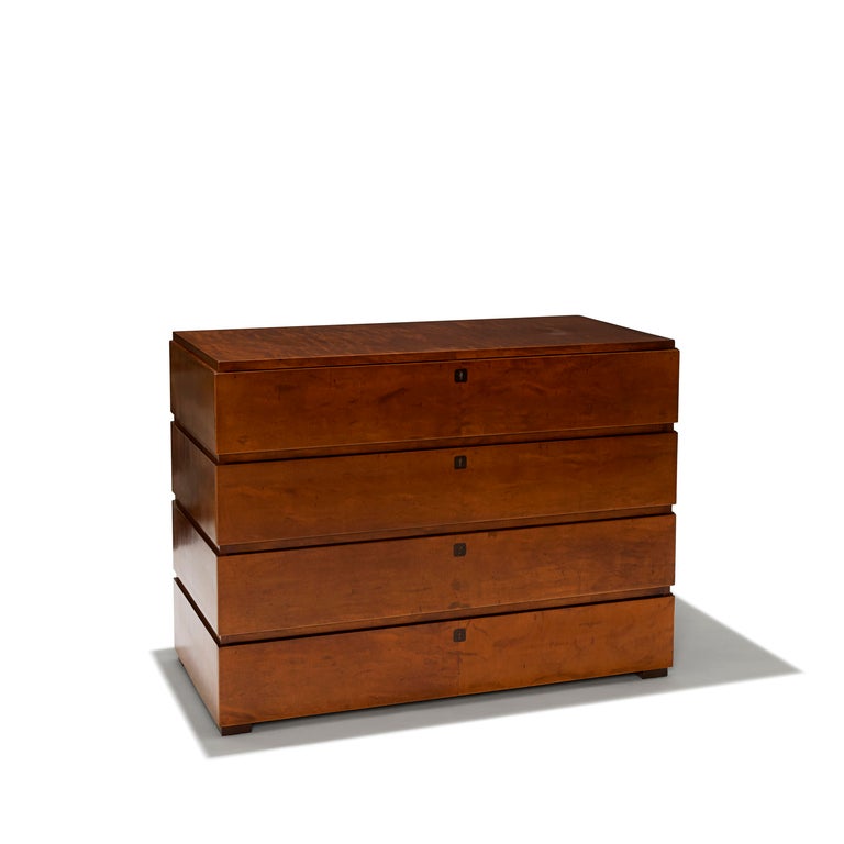 Superb sculptural chest of drawers in Baltic birch with four drawers, each with a lock and key. 

The work of Swedish architect and furniture designer Axel Einar Hjorth (1888-1959) is unmistakable for its inimitable sense of wit and elegance.