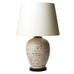 Table lamp with horizontal reeding and textured ivory glaze by Jacques Adnet