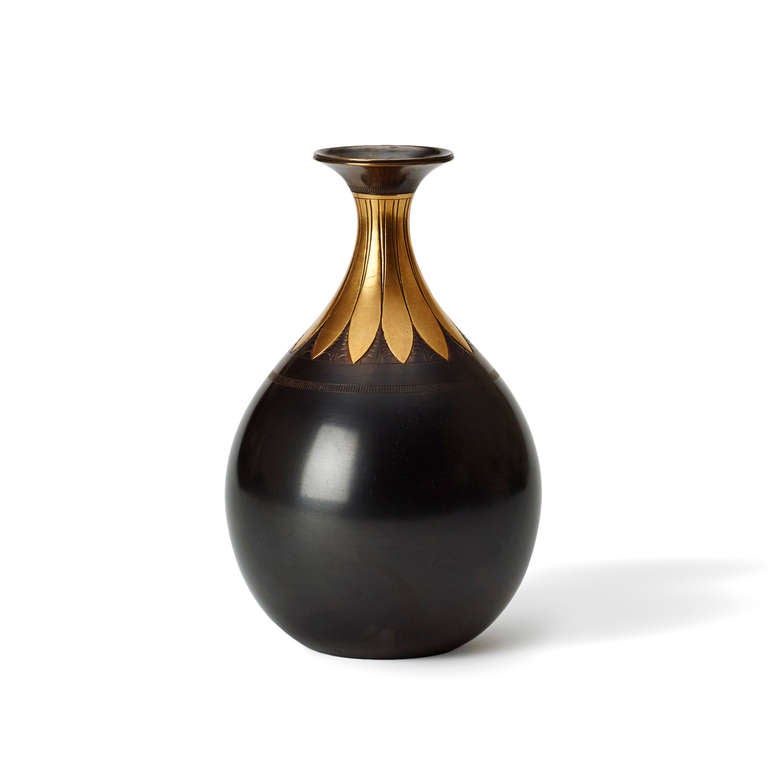 Tear-shaped patinated bronze vase with attenuated neck engraved and burnished with a lotus blossom pattern by Just Andersen (1884-1943), Denmark, 1920s. Stamped artist mark and number “8 or 6 -75”