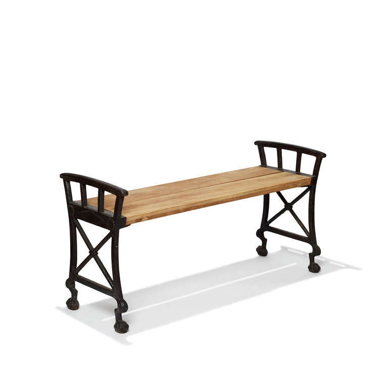 Modern classicism Parkbänk No.2 bench with lion paw feet on springing legs, in painted cast iron with wood slat seats, designed by Folke Bensow (1886-1971) for Na¨fveqvarns Bruk (Foundry), Sweden, 1920s. Measures: 16 in. (41 cm) H seat / 20 in. (51