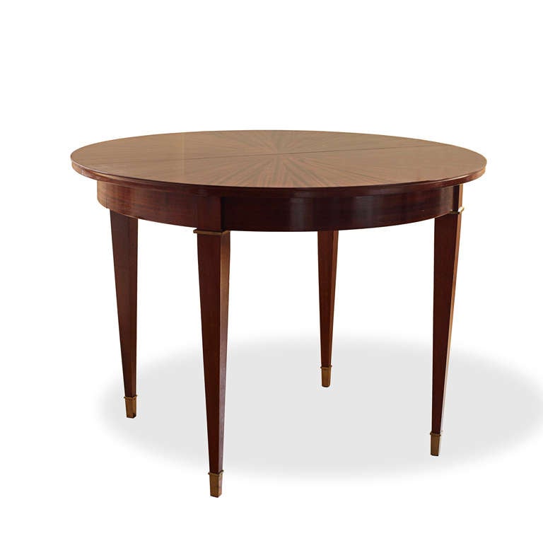 French architect Jacques Adnet (1900-1984) worked for Maurice Dufrêne before establishing himself as a successful decorator, operating in an elegant but logic-driven style for Parisian society.

This fine game or dining table in Cuban mahogany by
