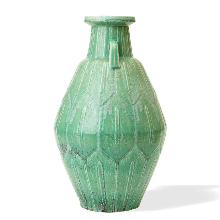 Unique monumental vase with angled round body and handles, featuring surface relief pattern of hexagons, with fluted neck, by Gunnar Nylund (1904-1997) for Rörstrand, stoneware with jade green glaze, Sweden 1940s. Inscribed artist initials and