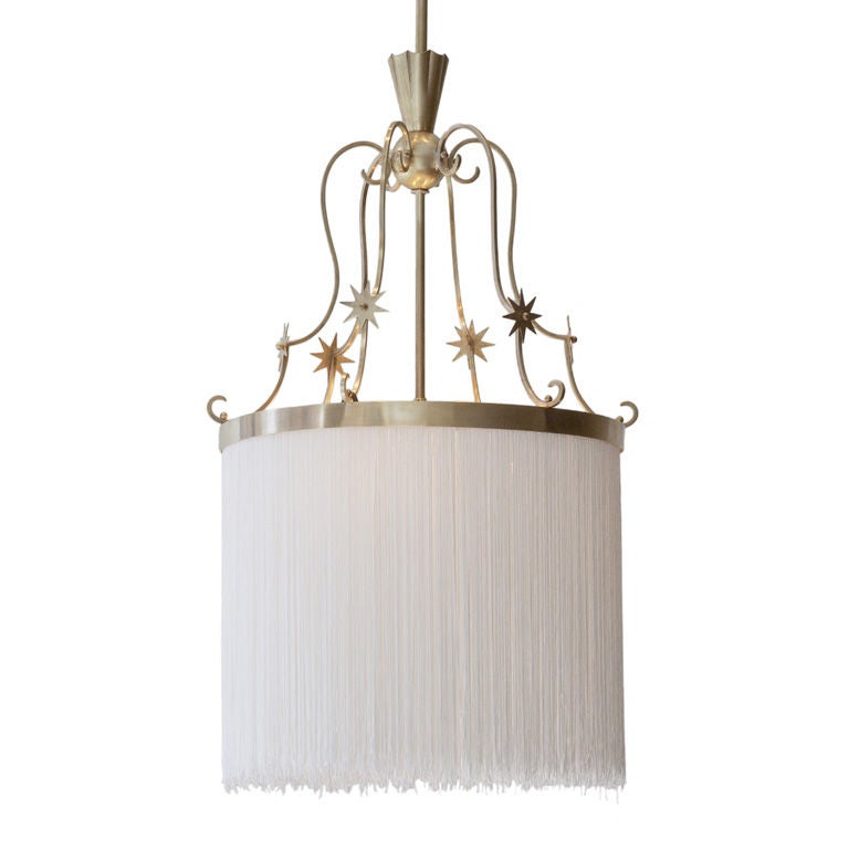 Brass and fringe fixture by Carl G. Hallberg