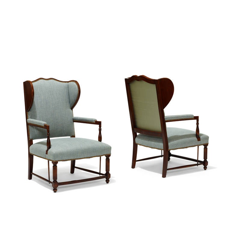 Pair of wingback chairs with stained birch frames, blue and ivory silk-linen tweed upholstery and blue shantung silk back panels, Sweden, 1920s. The design balances the charm of this vernacular form with a crisp 20th century sensibility.