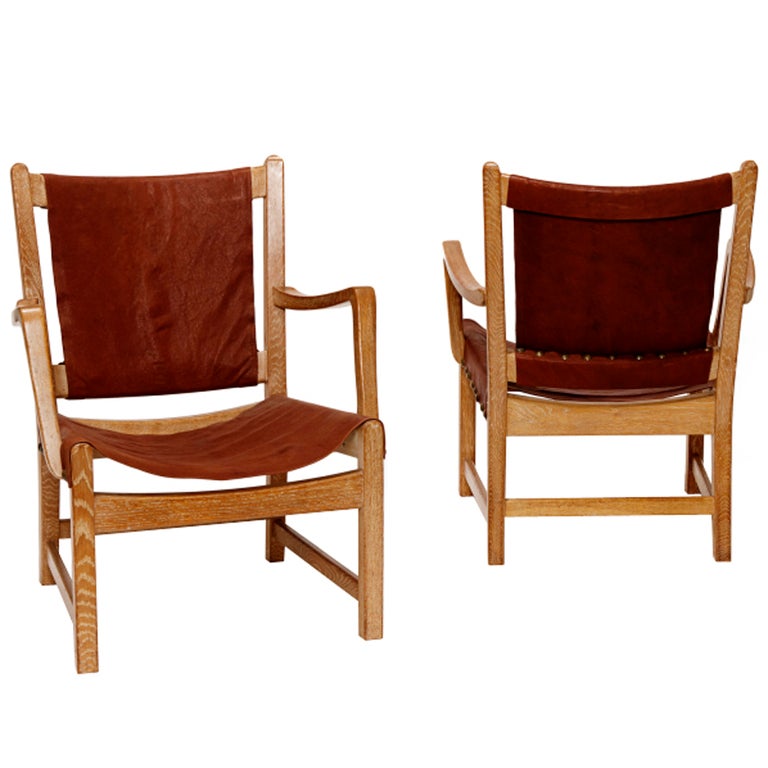 Pair limed oak and leather armchairs by Axel Einar Hjorth