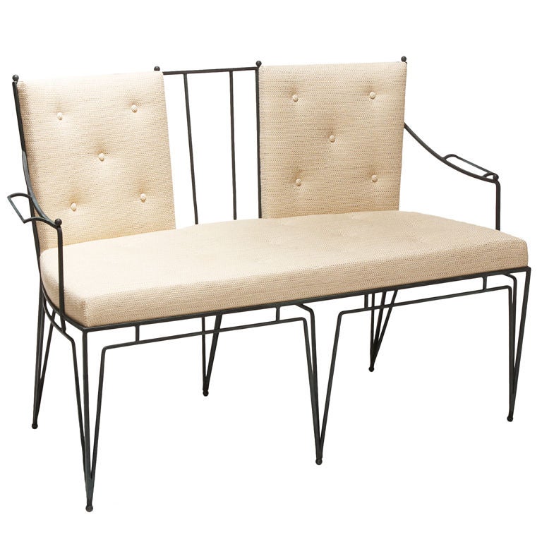 Wrought iron settee and chairs by Marc du Plantier