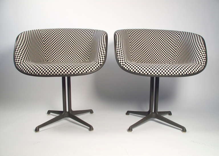 Rare pair of Eames La Fonda arm chairs covered in Alexander Girard's black and white check fabric. Gun metal bases.