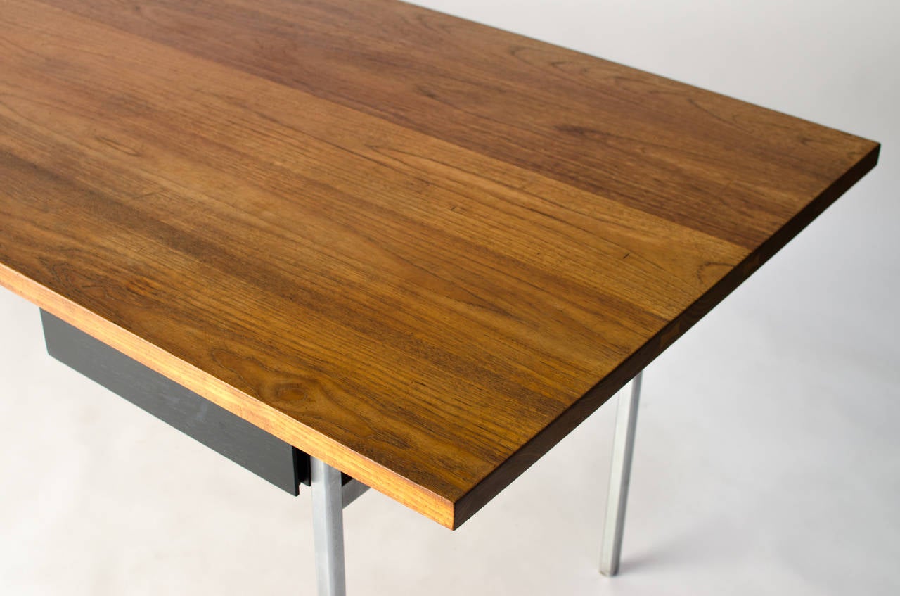 Rare solid walnut and steel single-drawer executive desk designed by Florence Knoll and George Nakashima, circa 1950s. This is a rare collaboration that most likely has ties with the ALCOA furniture that featured works by the designer duo. 

This