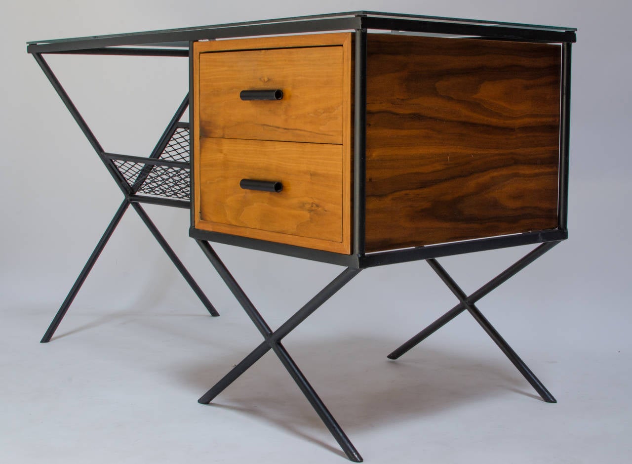 Rare Muriel Coleman for California Contemporary X-base desk, circa 1950 Sausalito, CA. Glass top, two birch drawer cabinet and an expanded metal storage area below. This was one of Coleman's most successful designs. 

Coleman was part of the