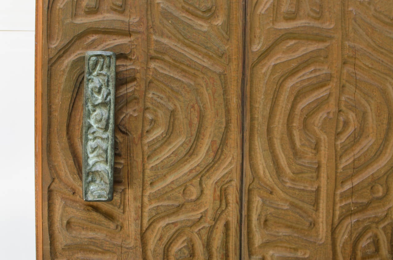 Amazing redwood door designed by Evelyn Ackerman for ERA Industries, circa 1960s, California. All original massive door with ERA bronze hardware. 

Door pull measures: 14.75