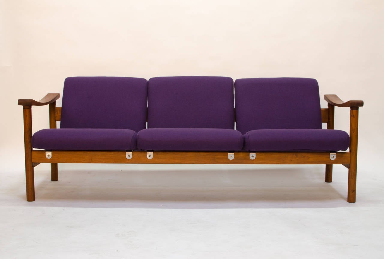 Exceptionally original teak sofa designed by Hans Wegner for GETAMA Gedsted model GE-280/3, dating to 1960. The sofa has been upholstered once by the original owner and the fabric has not been abused, but does show signs of age commensurate with